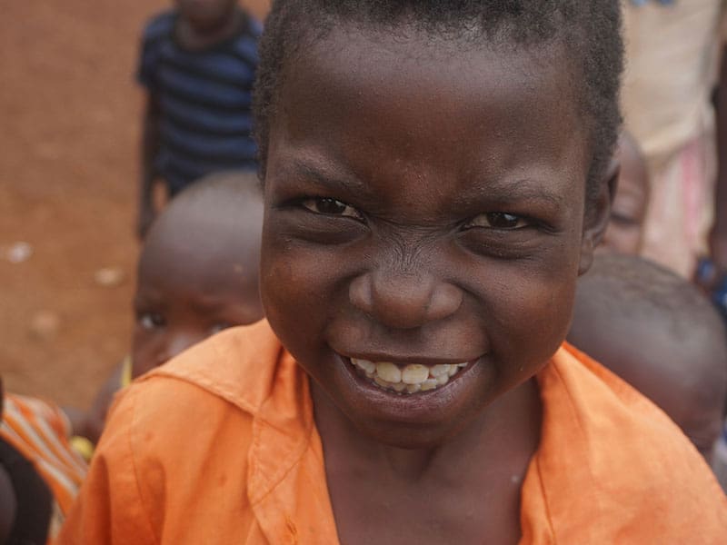 A young boy smiling for the camera.