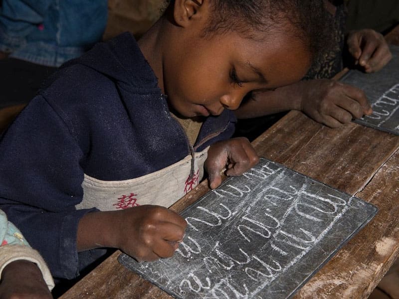 A child is making some type of object