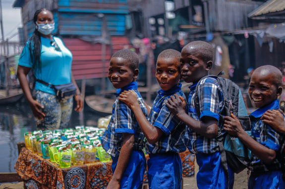 A group of young boys standing next to each other.