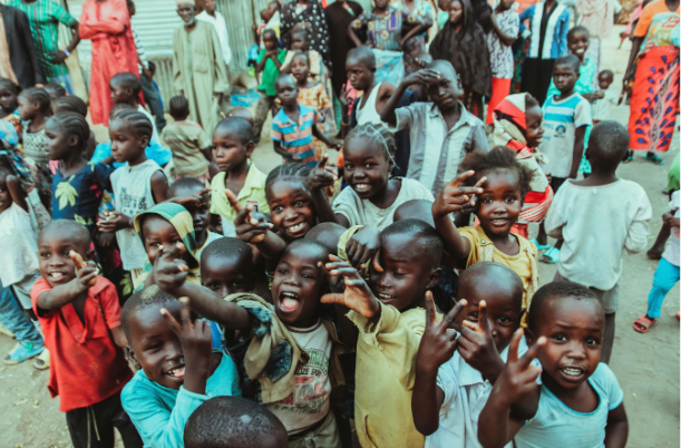 A group of children standing next to each other.